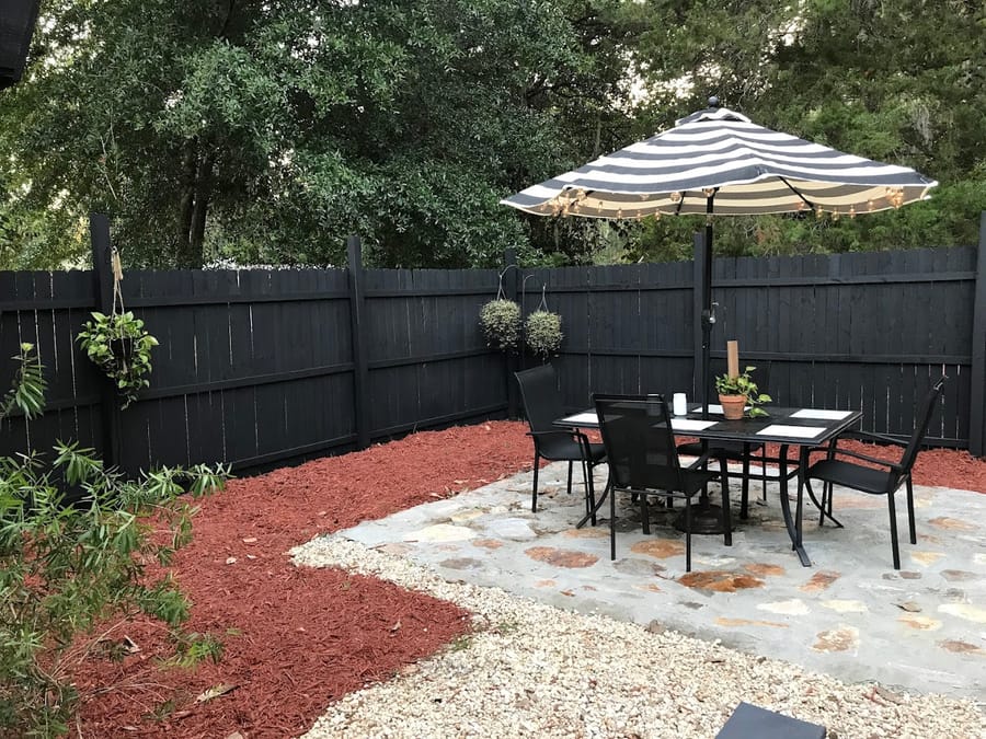 Finished flagstone patio with red mulch and white river gravel