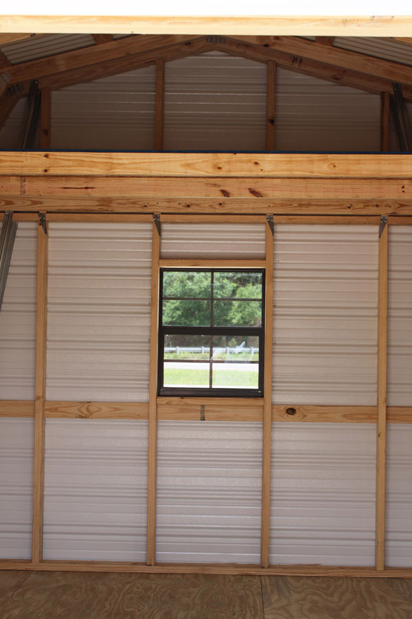 Interior of a high-loft barn-style aluminum shed