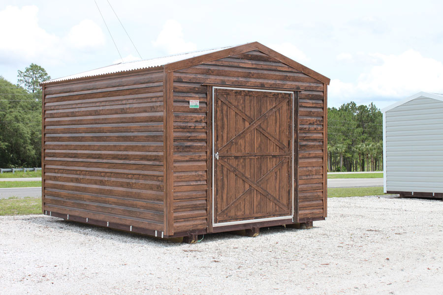 Aluminum storage shed with rustic paneling and a metal roof